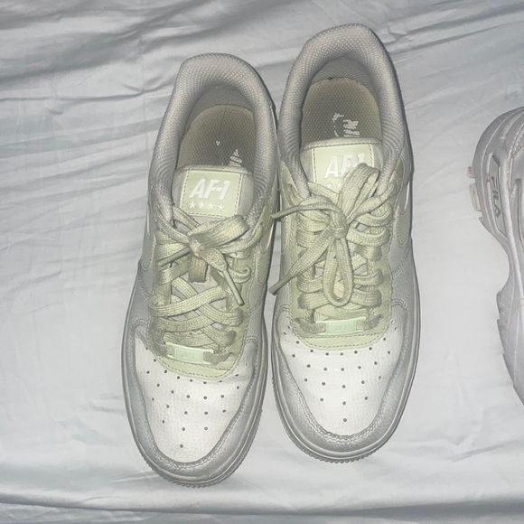 White Nike air max’s with green detailing